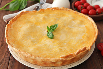 Delicious meat pie on table