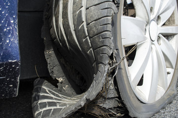 damaged tire after tire explosion at high speed on highway - obrazy, fototapety, plakaty