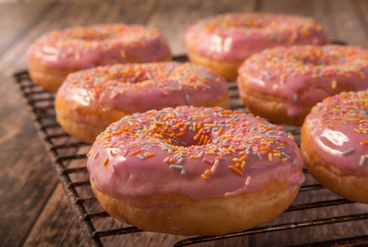 Pink Donuts on a wire Cooling Rack