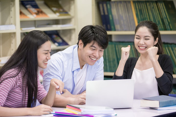 Group of Student Seaching information in the library with attractive smiling together. People with Education concept. People with Success for work.