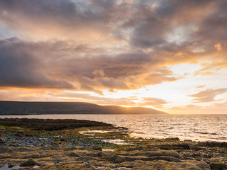 Sunset at low tide. west coast of Ireland. county Clare, The Burren National park.