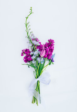 A colorful bouquet of spring flowers on a white background