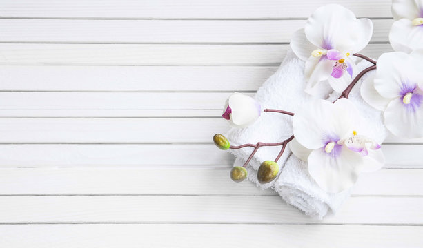 SPA setting with orchid flower and towels, overhead shot