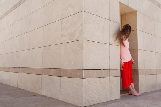 blond model leaning on the wall