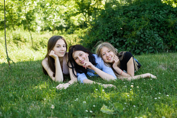 Fototapeta premium three girls having fun outdoors. women's friendship
