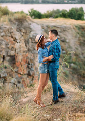 A loving couple is walking in the mountains. Creative toning.