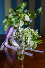 small bouquet in a glass on a table
