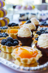 muffin with cream on a tray