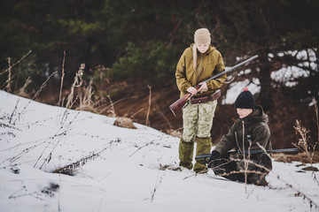 Naklejka premium two hunters tracking prey and ready to hunt.
