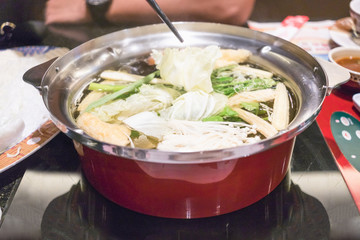 Close up healthy food in red pot from high angle view