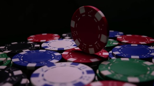 Poker Table With Red Poker Chip Turns In Casino On Many Colored Chips