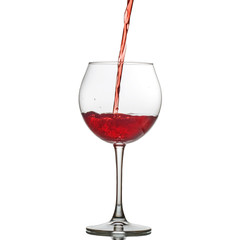 Red wine poured into a glass. The concept of alcoholic beverages, restaurant, cafe, utensils, holiday.
