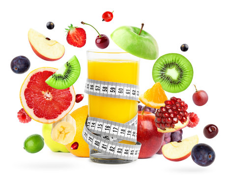 Mixed fruits falling and orange juice