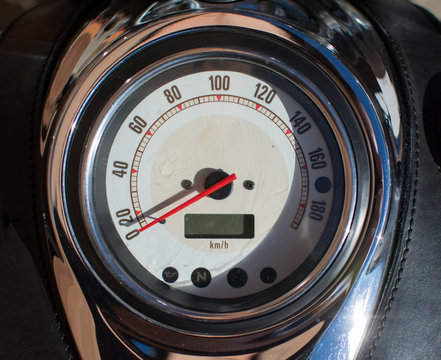 Motorcycle gauge and instrument cluster photographed from close distance