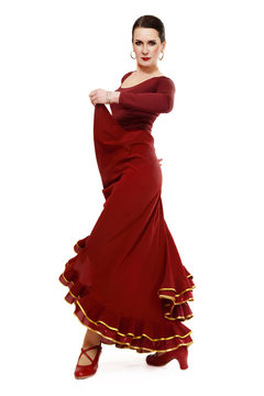 Attractive woman dancing flamenco over white background