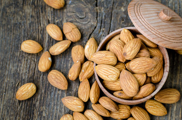 Almonds on the old wooden background
