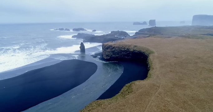 Kirkjufjara beach and Arnardrangur cliff. Popular tourist attraction. Dramatic scene. Location place Sudurland, cape Dyrholaey, Vic village, Myrdal Valley, Iceland.