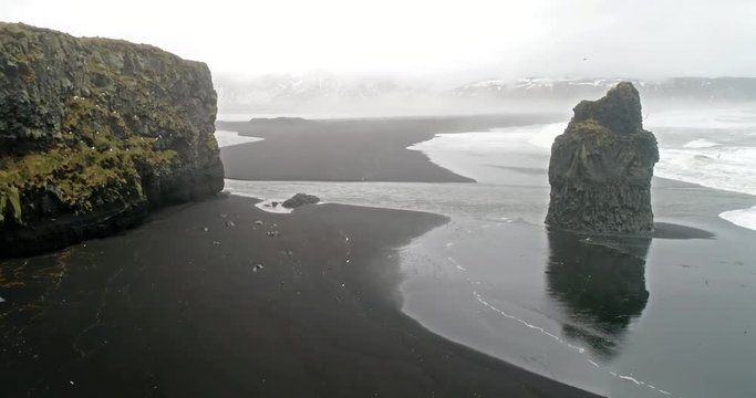 Kirkjufjara beach and Arnardrangur cliff. Popular tourist attraction. Dramatic scene. Location place Sudurland, cape Dyrholaey, Vic village, Myrdal Valley, Iceland.