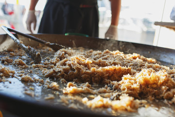 Freshly prepared juicy traditional Bavarian cabbage in a large frying pan during the octoberfest season. 