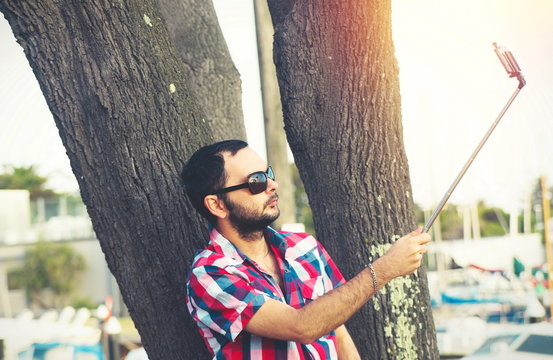 man with beard taking selfie picture