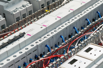 A series of modular magnetic contactors and a range of power circuit breakers. Between the rows of...