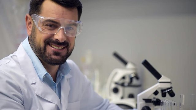 Portrait of radiant scientist smiling into camera