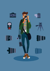 Young male photographer with many photo equipment