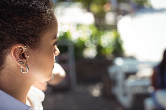 Waitress with ears piercing looking away