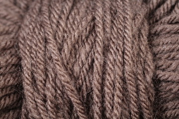 A super close up image of chocolate brown yarn