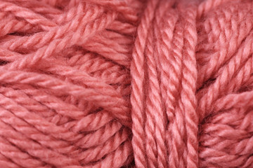 A super close up image of pink yarn
