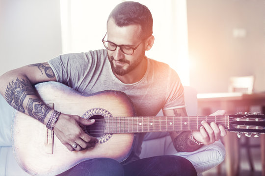 Handsome Man Playing Acoustic Guitar