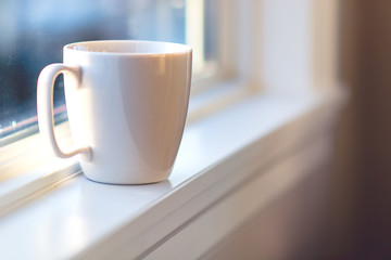 White Coffee Mug in the Window