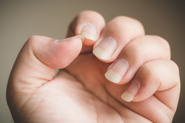 Looking at own finger nails unvarnished natural