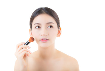 Beauty asian woman applying make up with brush isolated on white background, health clean skin cosmetics concept.