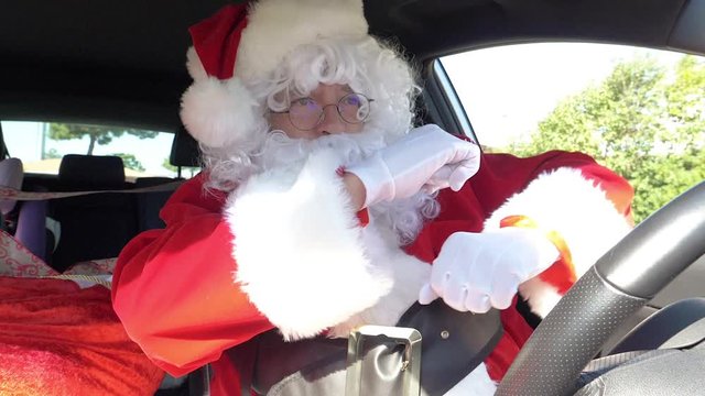 Santa Claus dancing happy while driving car super slow motion 4K