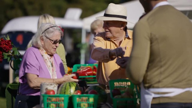  Senior couple shopping at a farmers market