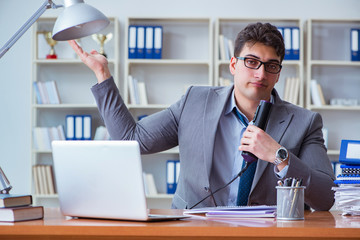 Businessman sweating excessively smelling bad in office at workp