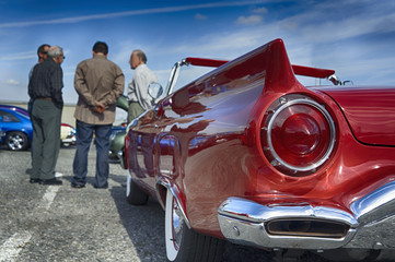Unidentified people at a vintage car show