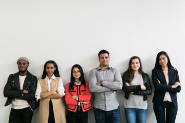 Young men and women looking at the camera