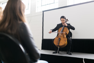 Young man on stage playing the cello © ZeroThree