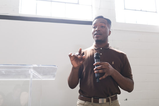 Young Man Talking On Stage