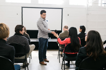 Audience asking questions during a presentation