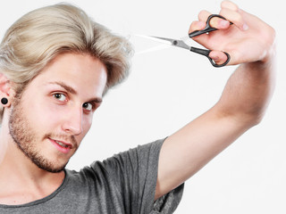 Man with scissors ready to hair cutting