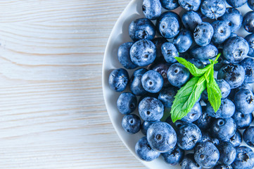 Blueberries with leaves in white background