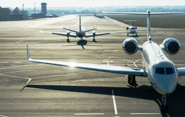 Private jet planes on the landing line in the morning time.