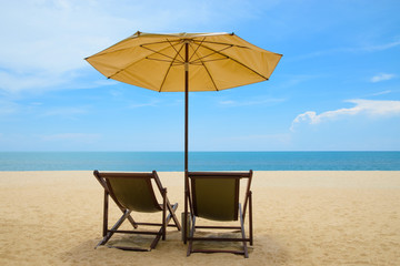 Beach chairs and umbrella on beautiful sand beach with cloudy and blue sky - 173861824