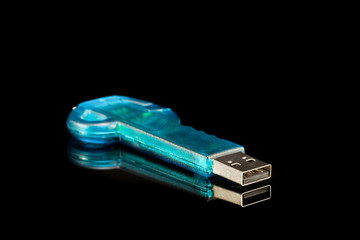 Blue USB flash memory on black background