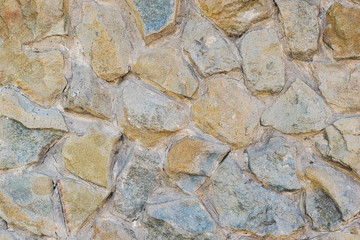 Background wall of the large beautiful stones laid on mortar.