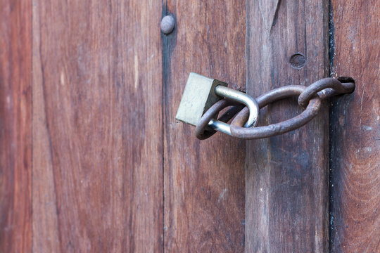 Lock key on old wooden door.