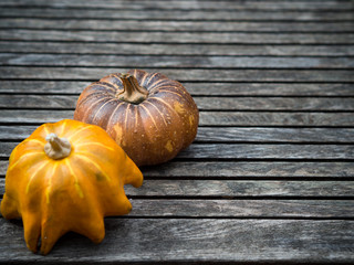 Pumpkins on rustic vintage wooden table, for food, fresh market, party, agriculture or Halloween resources 